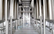 Industrial waste treatment machinery with pipes and control panels in a factory setting.