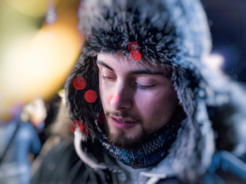 man wearing fur aviator hat