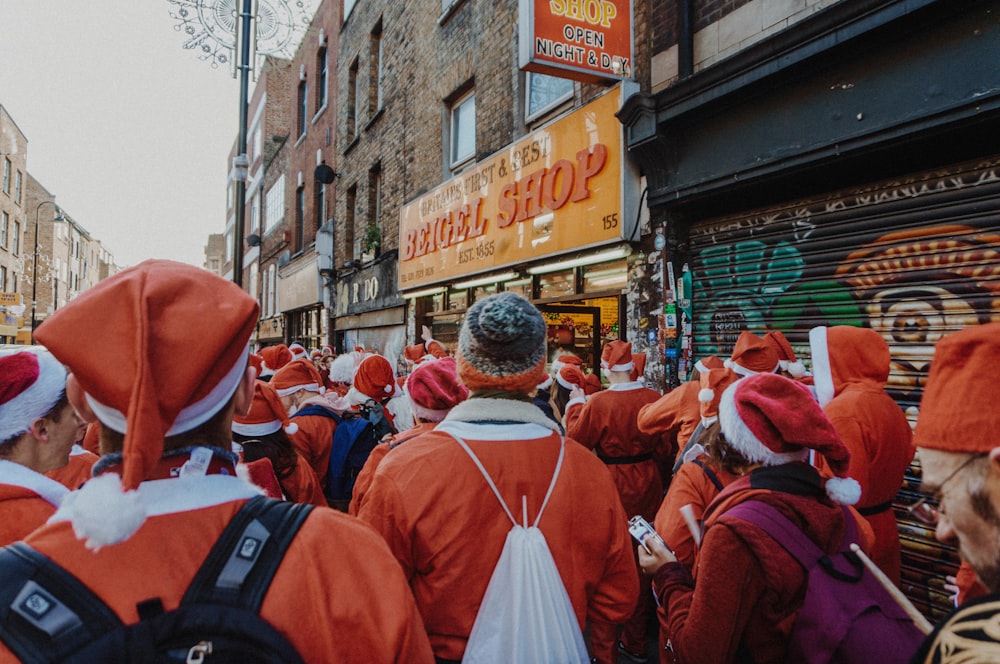 people wearing Santa costume on road