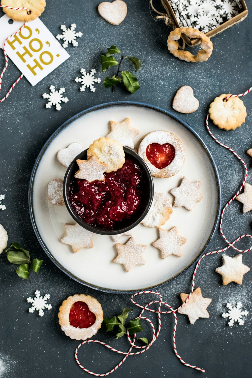 strawberry jam with star biscuits on plate