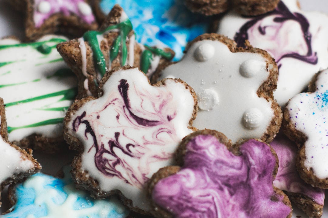 purple and white icing covered cookies