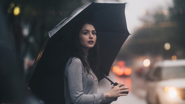 woman on the street holding umbrella