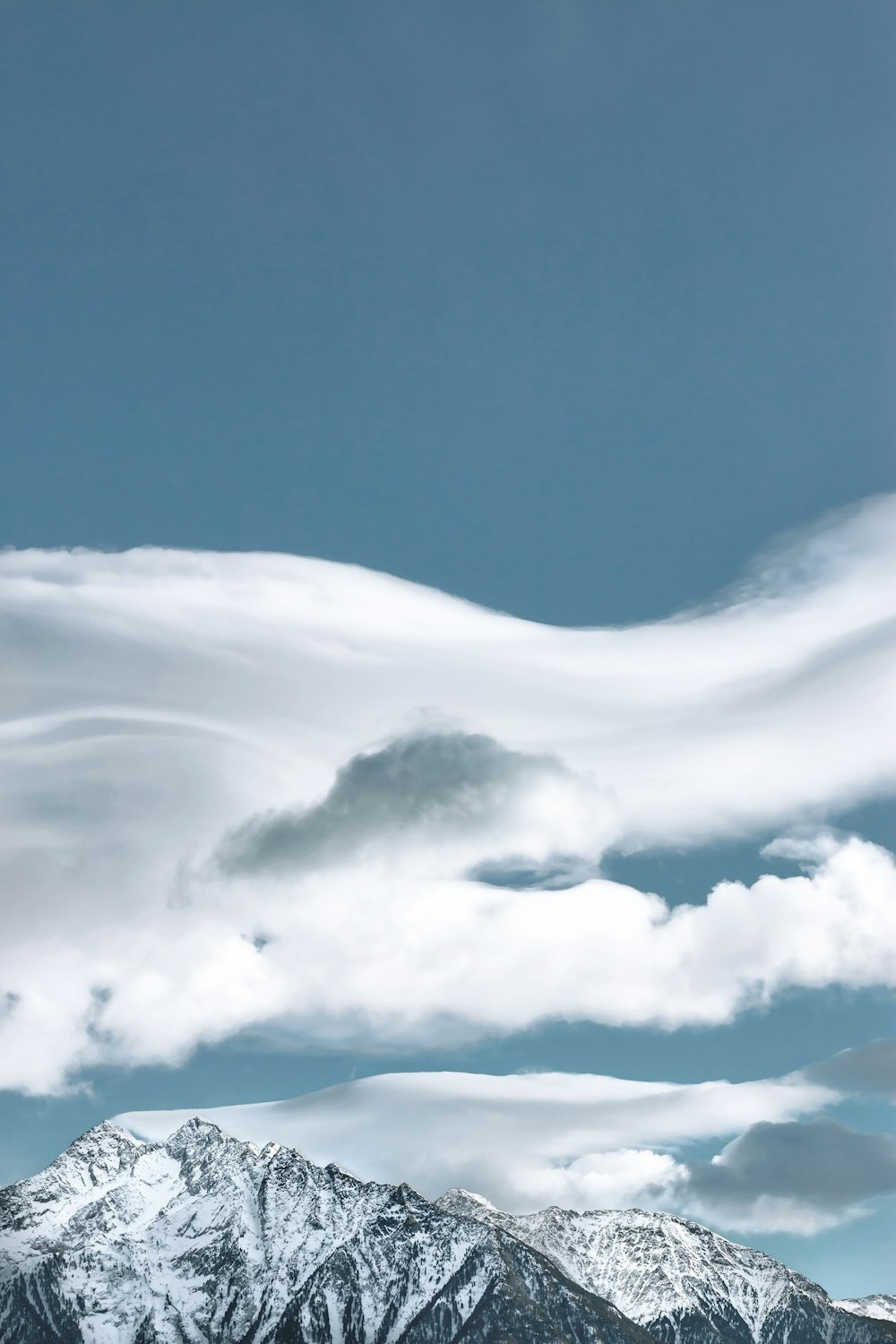 mountain under white clouds