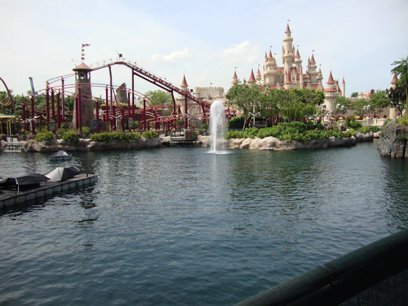 A magical theme park scene with joyful families and iconic attractions