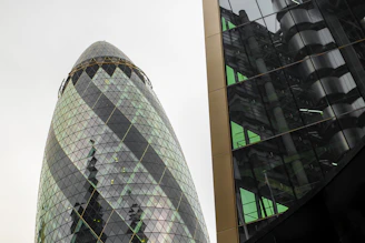 Architectural render showing a modern building with BIM data points highlighted.