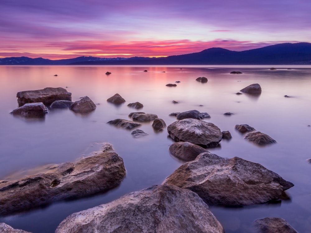 body of water during sunset