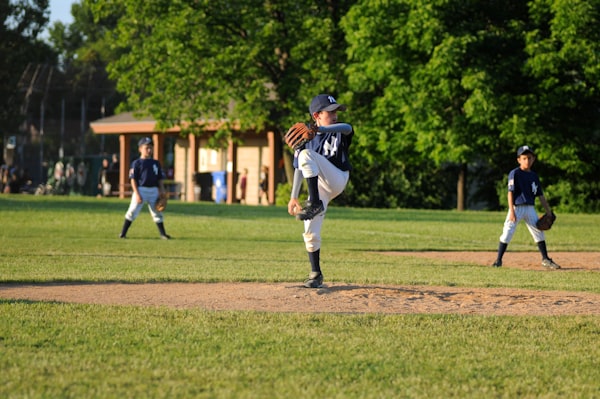 Youth baseball pitcher on field