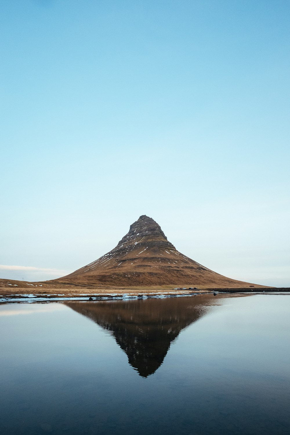 mountain near body of water photo