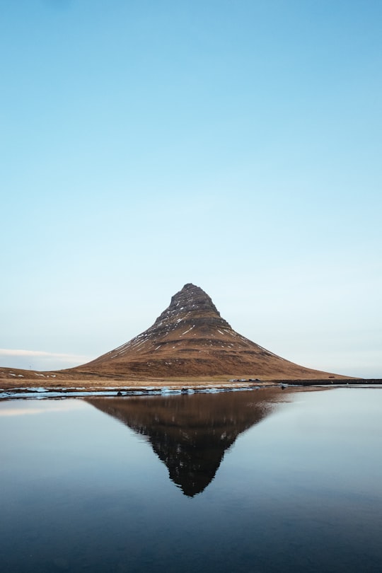 mountain near body of water photo in Kirkjufell Mountain Iceland