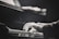 A close-up of a person's hands playing the piano. The image is in black and white, emphasizing the motion and focus on the keys. The piano is a Steinway & Sons model, showing a sense of elegance and quality.