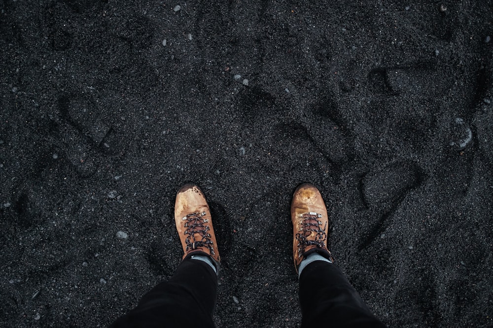 person wearing brown low-top shoes