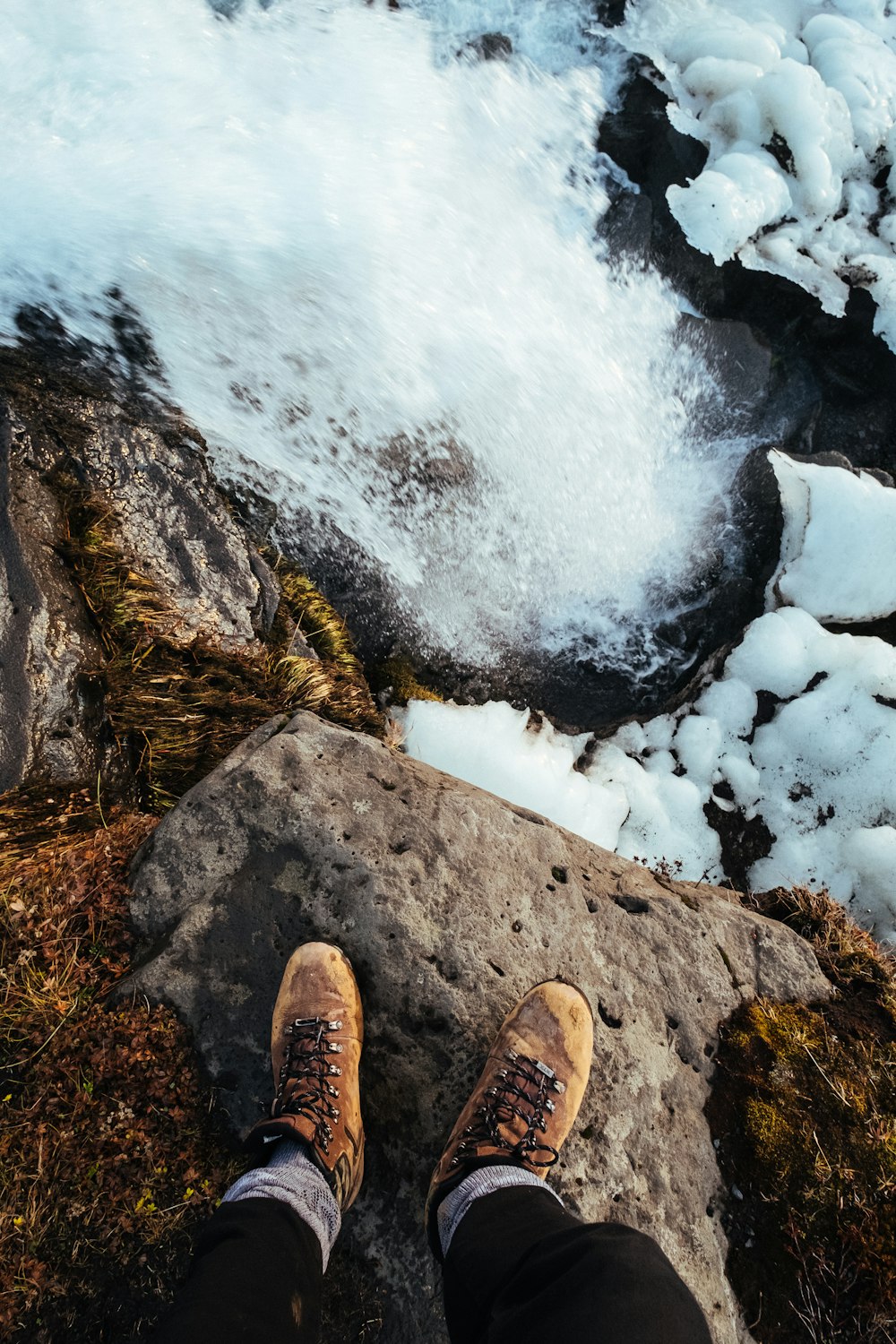 person standing on top of cliff