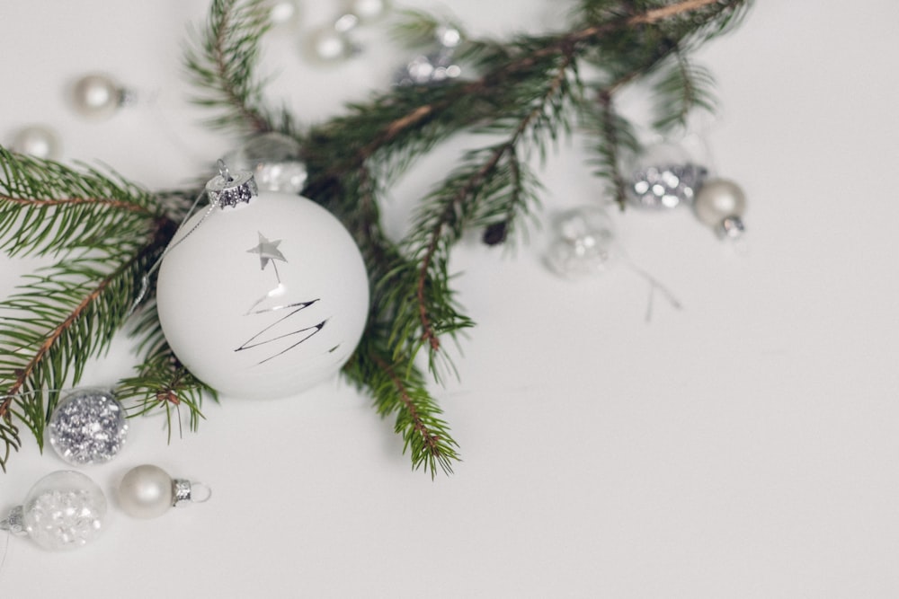 white bauble beside garland