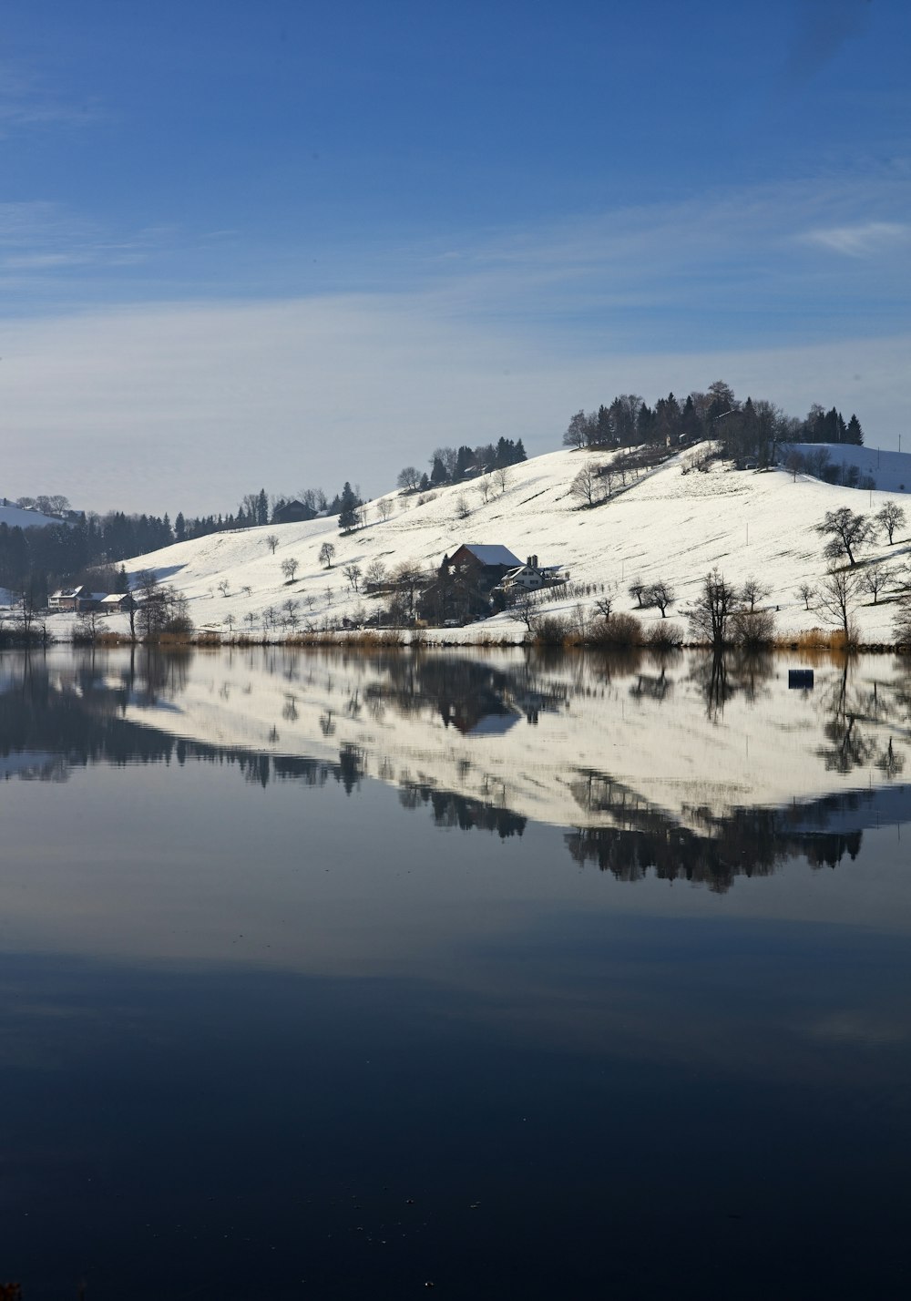 panoramic photography of house near white hill at daytime