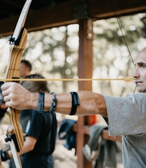 man using a brown bow