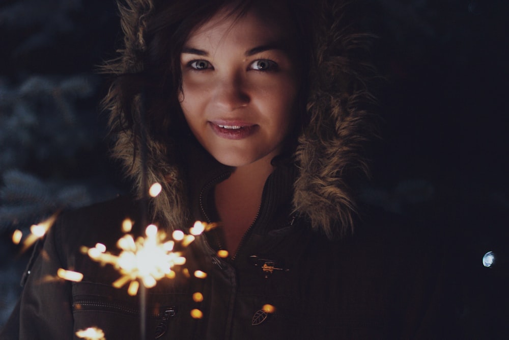 woman holding sparkler