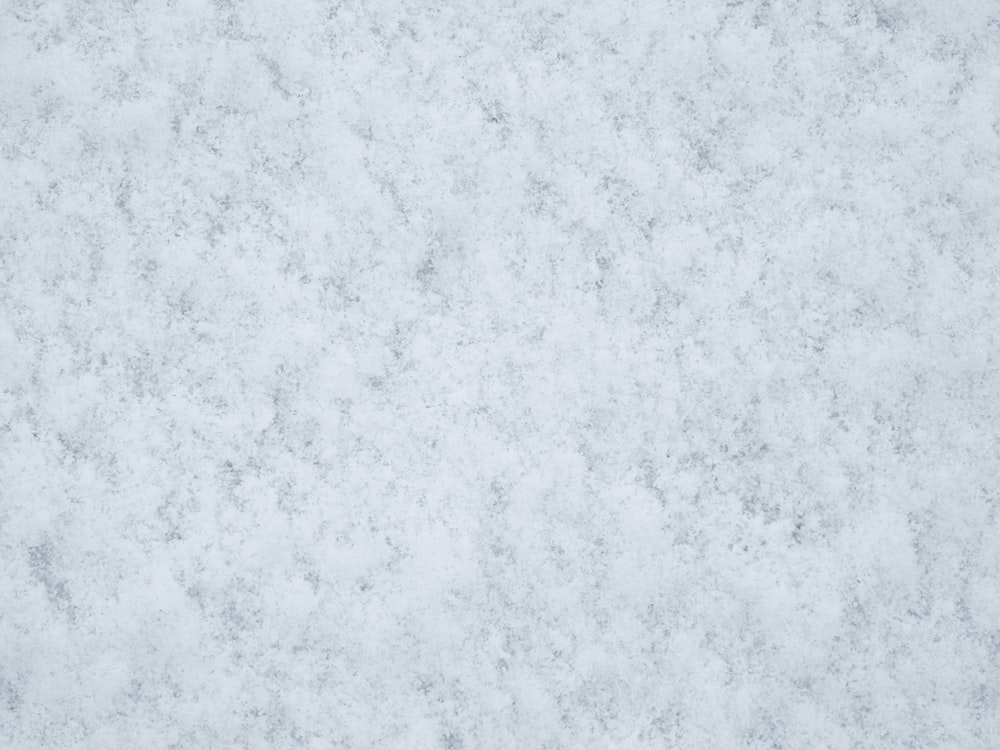 a close up of a white marble surface