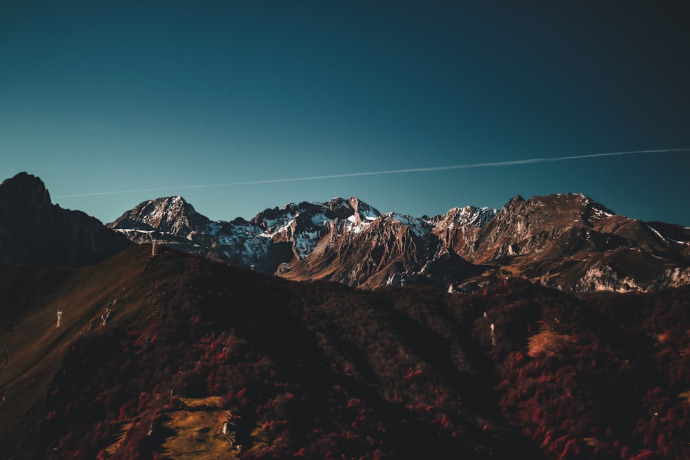 brown rocky mountain at blue hour