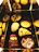 Close-up of a colorful Christmas snack box with assorted treats and festive decorations