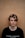 man in black crew-neck shirt near brown wall