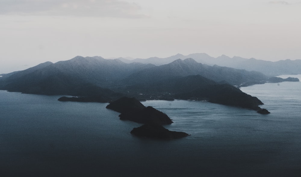 mountain range beside water