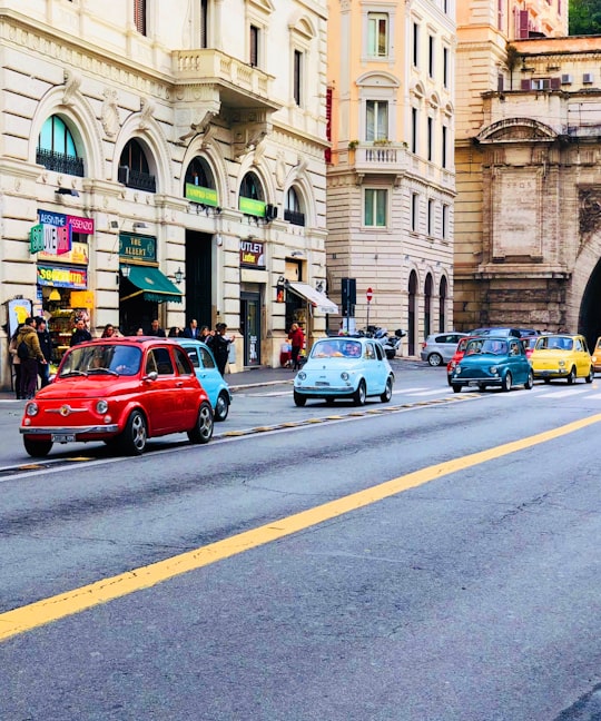 cars on road in Piazza di Trevi Italy