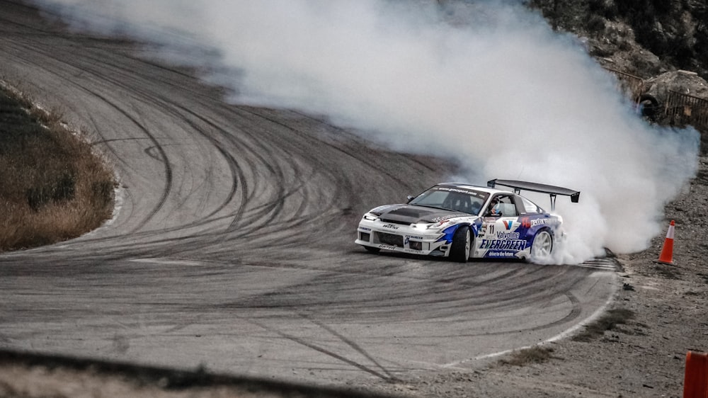 white and blue car drifting on wall