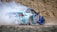 blue racing car on road during daytime