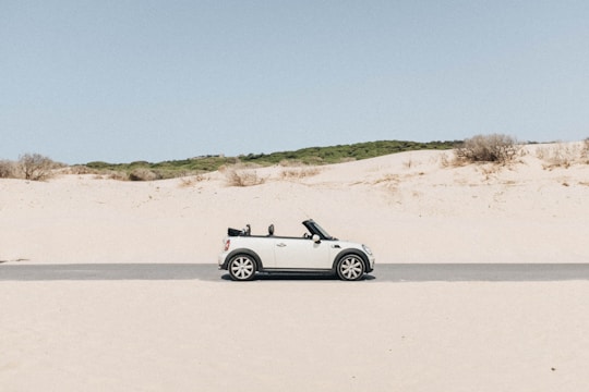 convertible coupe in middle of road