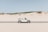 convertible coupe in middle of road