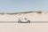 convertible coupe in middle of road