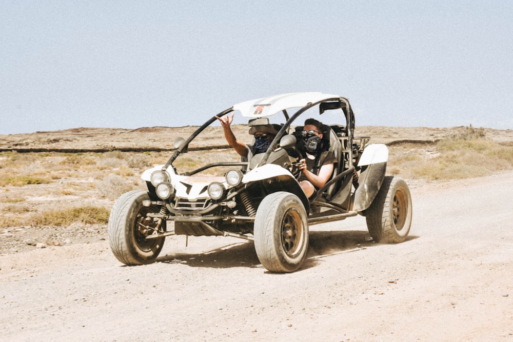 man riding UTV on road