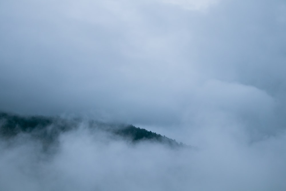 mountains under cloudy sky