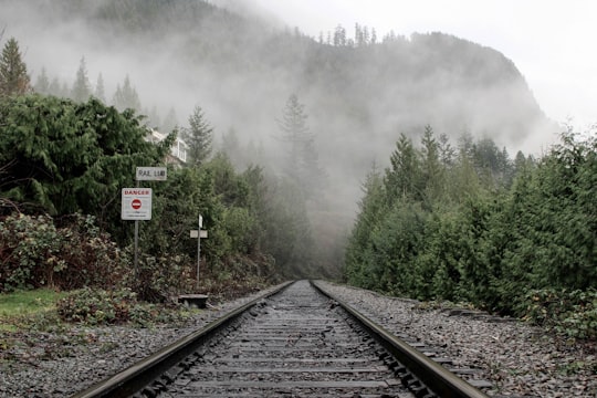 railroad leading to mountain covered with fogs in Lions Bay Canada