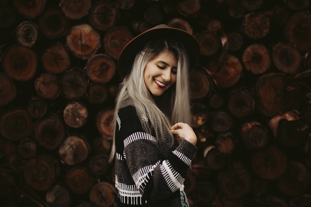 woman wearing black and white striped long-sleeved top