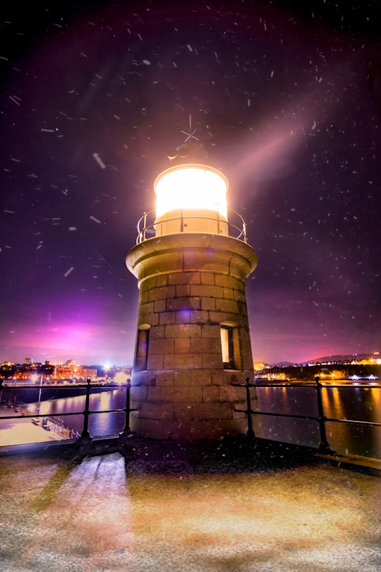 white lighthouse near cityscape in Folkestone United Kingdom