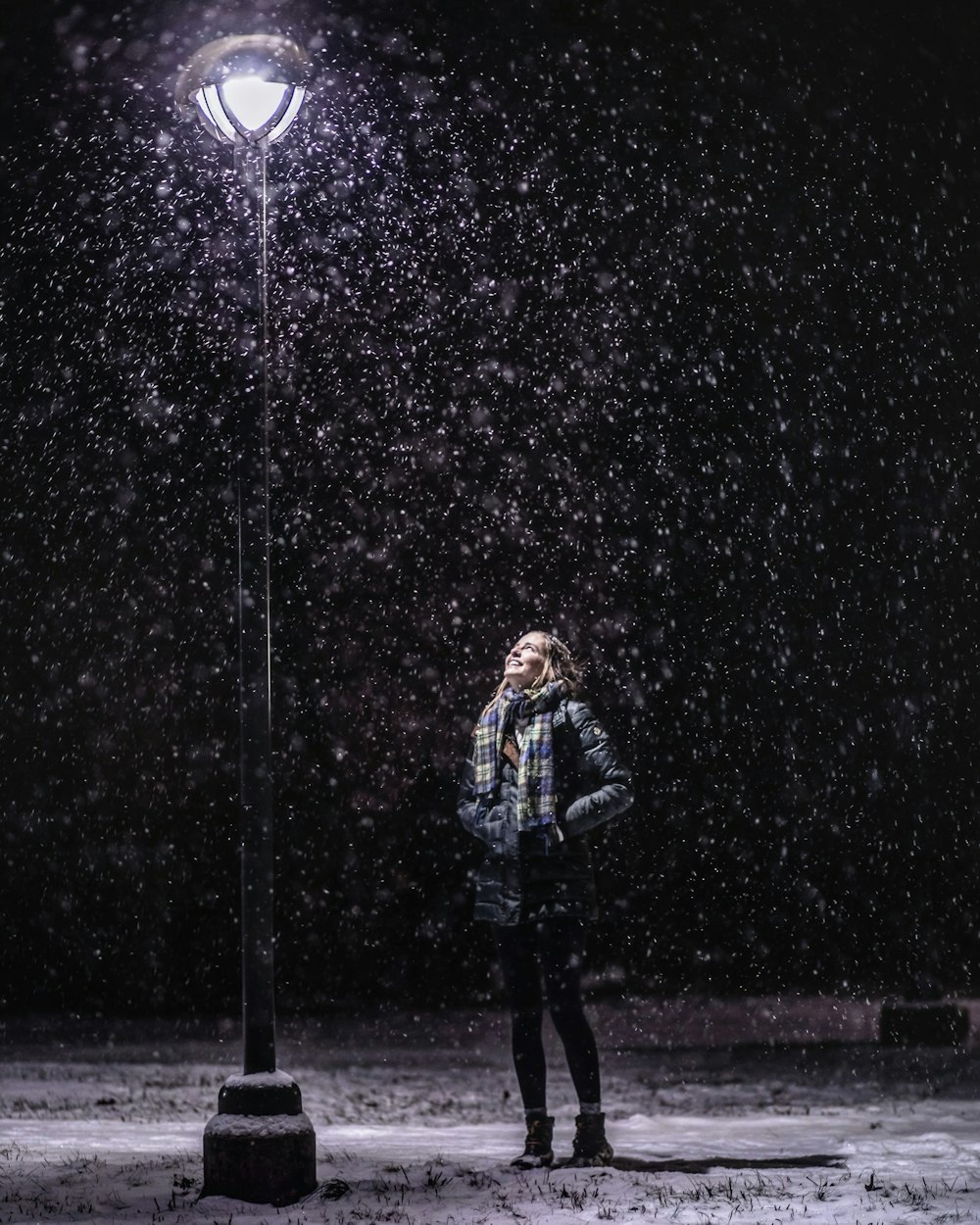 woman standing beside side post