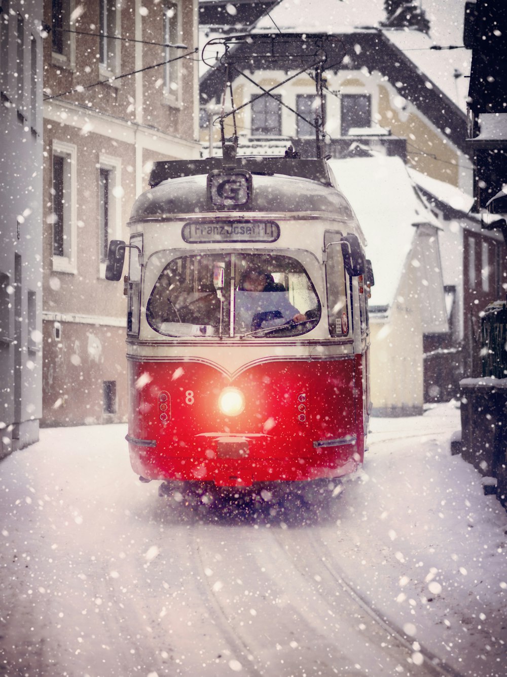 white and red cable train during winter