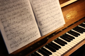 music note on brown piano