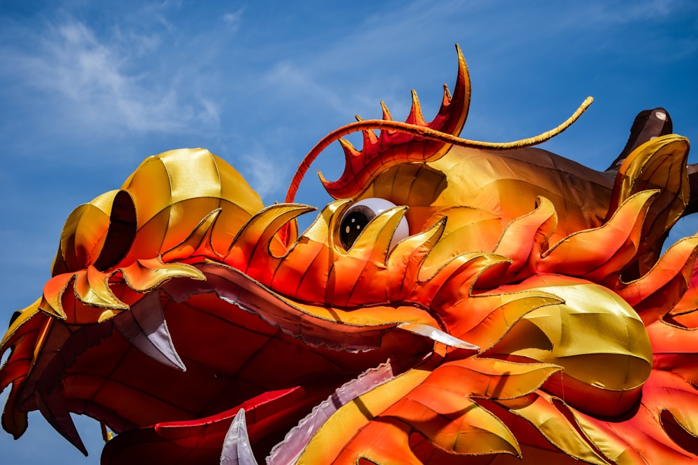 yellow and orange dragon mascot