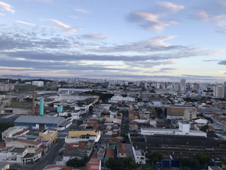 A panoramic view of Riyadh's bustling industrial district under a clear sky, showcasing the heart of Saudi Arabia's workforce demand.