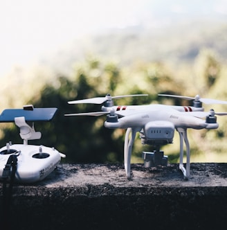 white quadcopter drone with remote