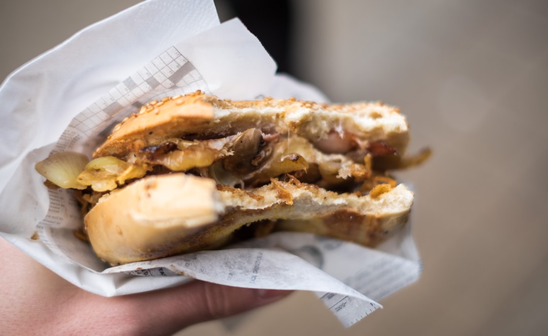 person holding burger, Bagel from the market