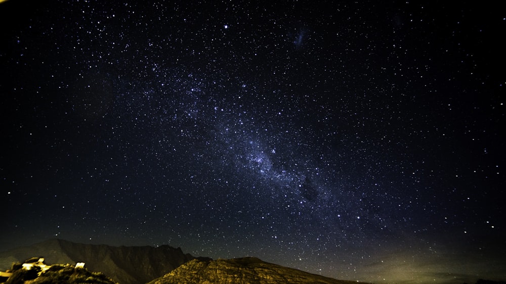 mountain under stars