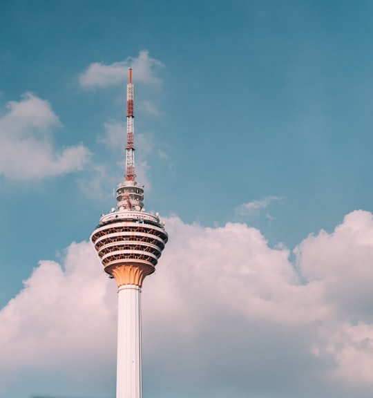white and red concrete tower at daytime in KL Tower Malaysia