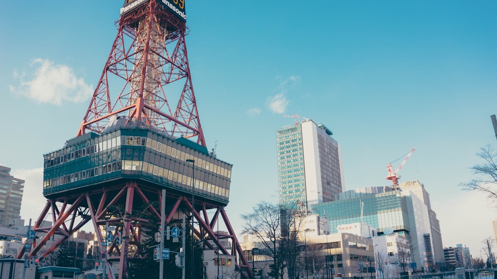 red and black tower beside building