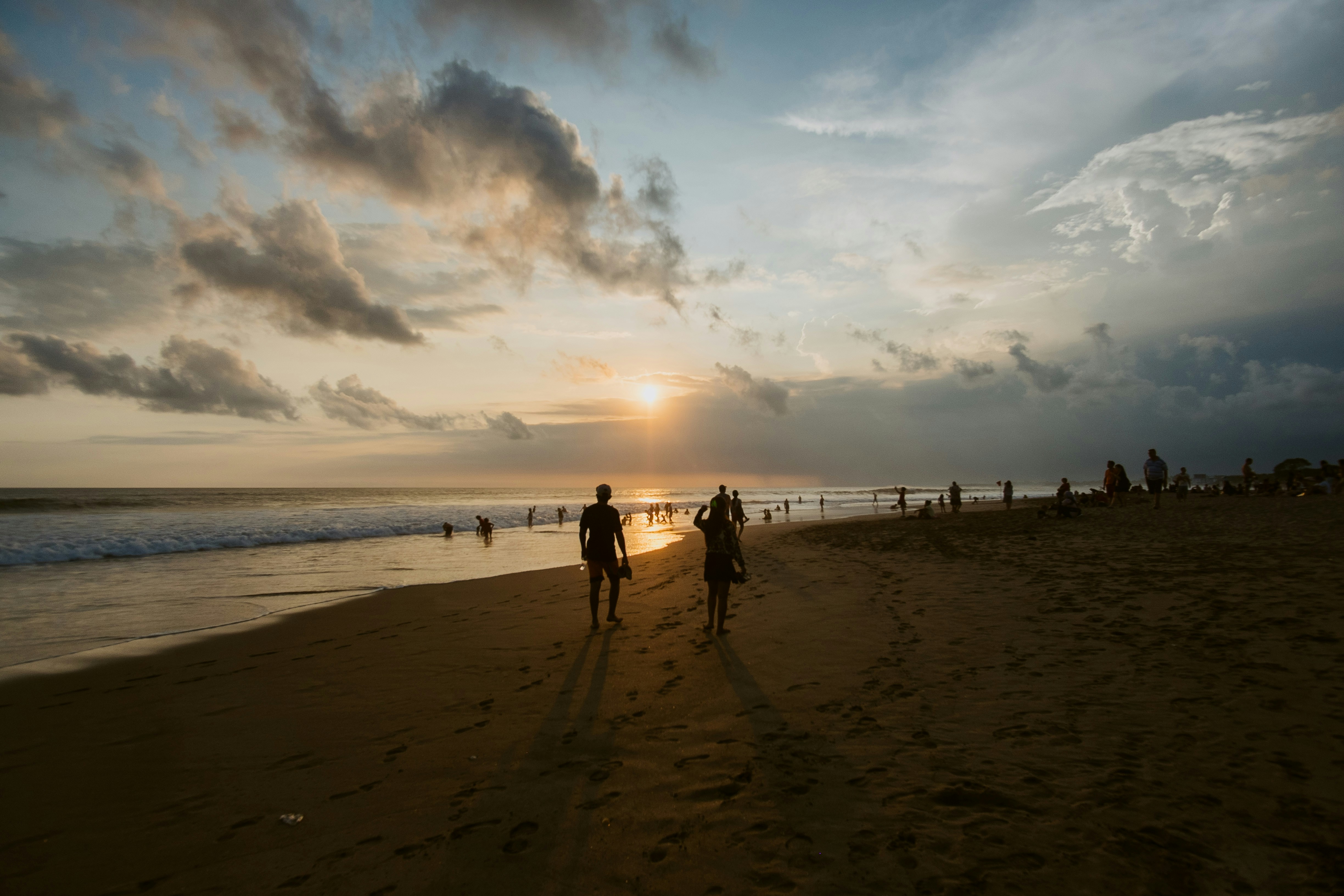 person walking on the beach during sun set, Sunset in Bali
