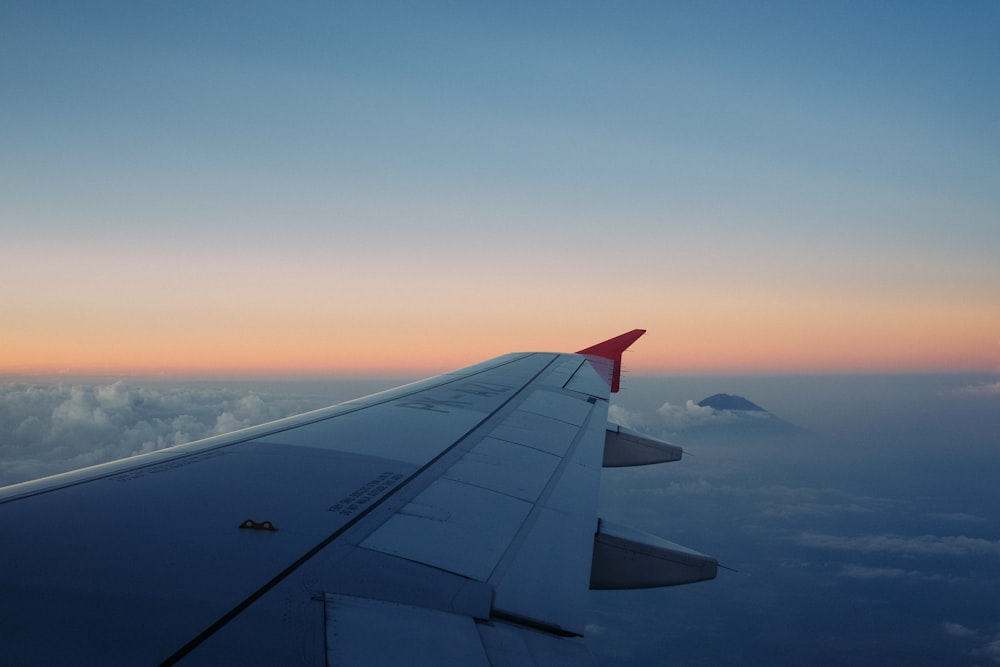 selective focus of airliner wing on the sky