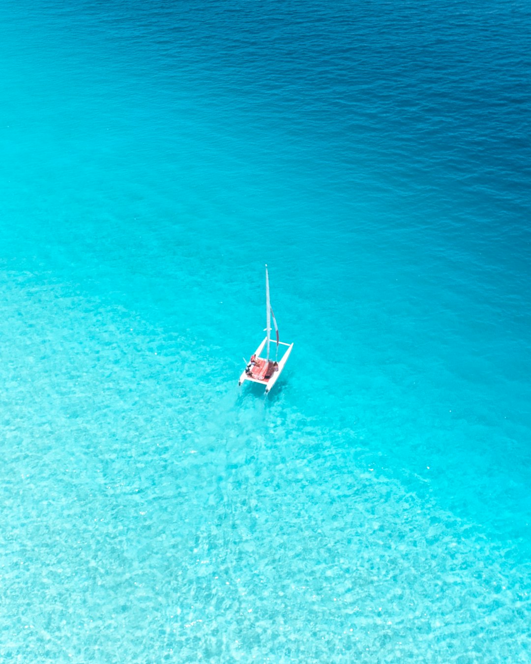 aerial view photography of sailboat on body of water