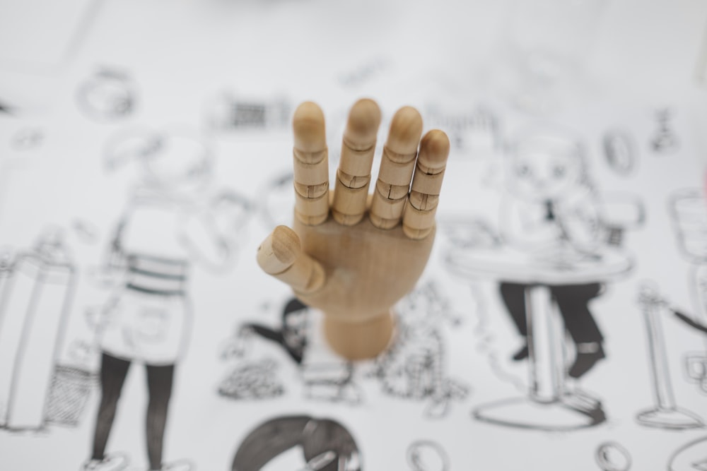 artist dummy hand on white paper